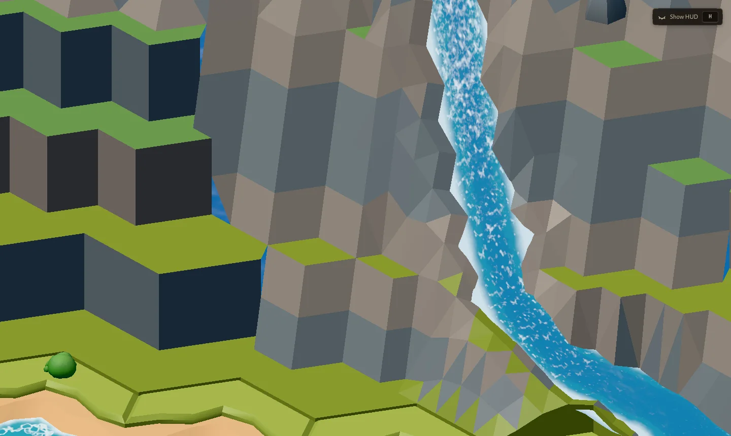Close-up of V1 mountains: flat-shaded grey triangles and dark box faces next to clean green hex tiles and a waterfall